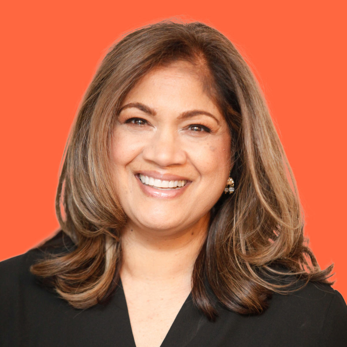 Portrait photo of Anita Valdez on an orange background.
